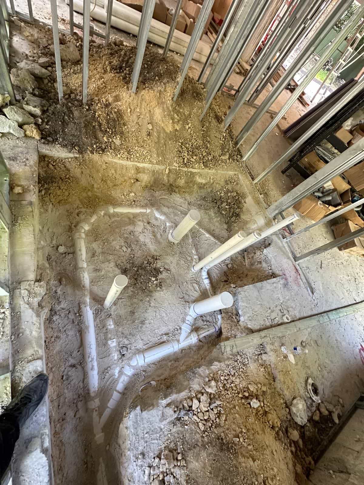 Before and after of a Underground pipe assemply by a plumber in Pinecrest